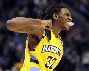 ORG XMIT: CTFB105 Marquette's Jae Crowder celebrates after his team's 74-67
overtime victory against Connecticut in an NCAA college basketball game in...