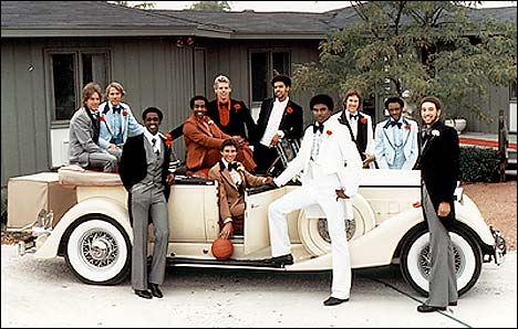1977 Championship team posed around a 1934 Packard Convertible