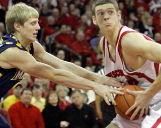 Wisconsin's Jon Leuer is fouled by Marquette's Scott Christopherson in the 2nd
half. The University of Wisconsin Men's basketball team hosted Marquette
University at the Kohl Center Saturday December 8, 2007. Steve Apps-State...